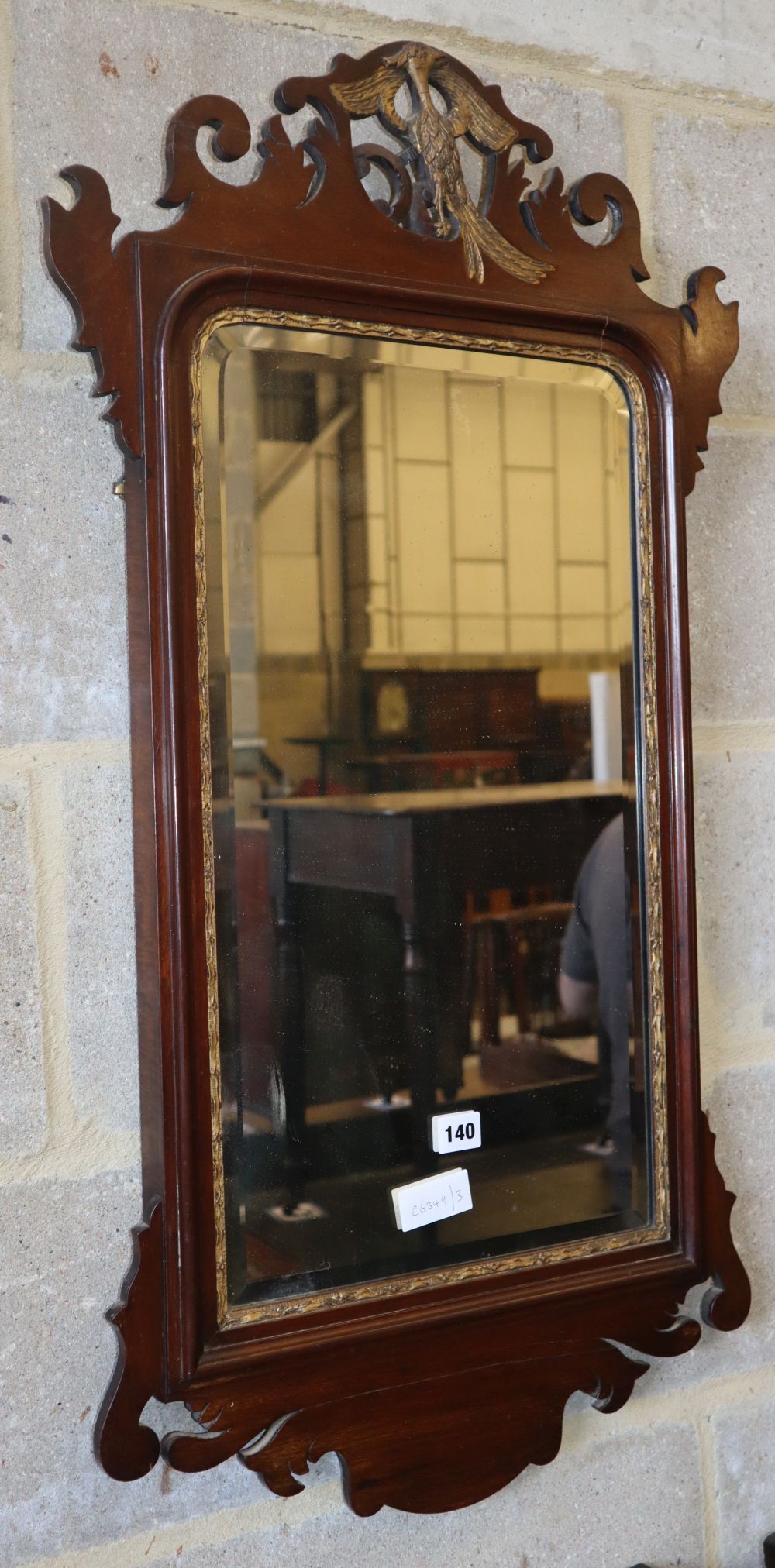 A George III style mahogany fret cut wall mirror, W.49cm, H.88cm